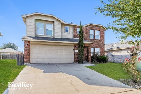 a house with a driveway and a garage door