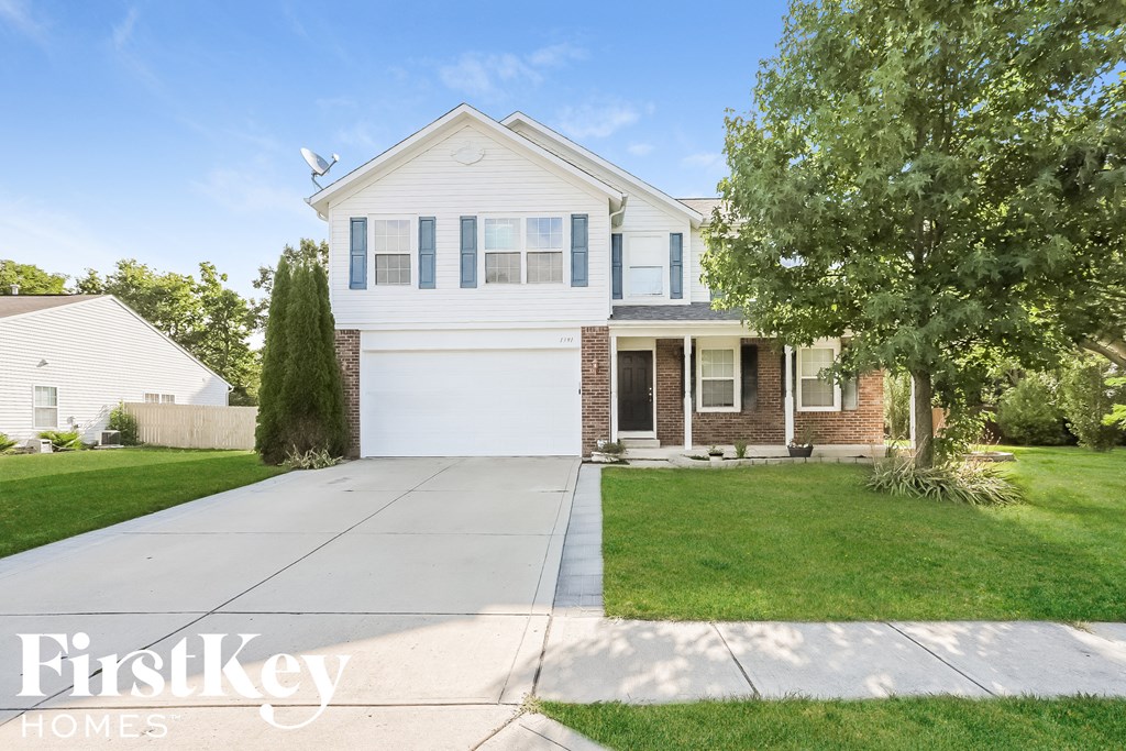 A house with a garage is for sale by FirstKey Homes.