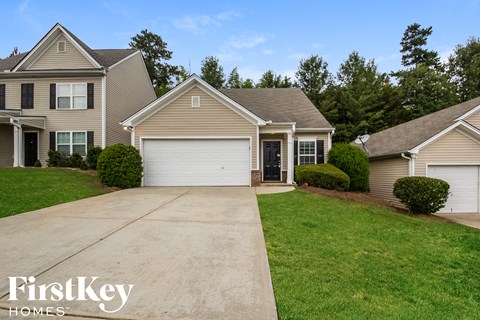 A house with a garage is for sale by FirstKey Homes.