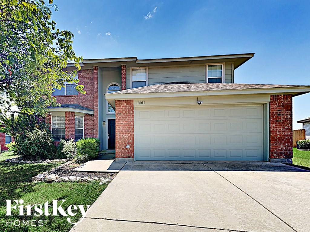 A house with a garage door that says 161 on it.