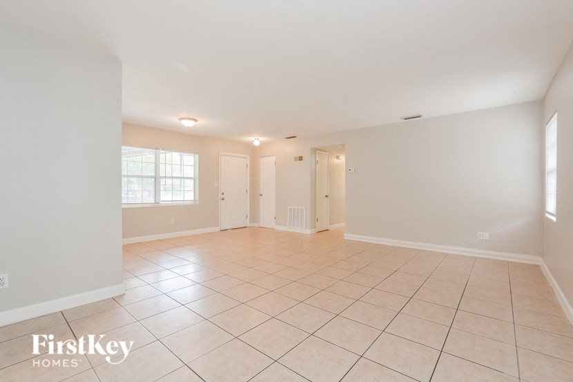 the living room and dining room are spacious and empty