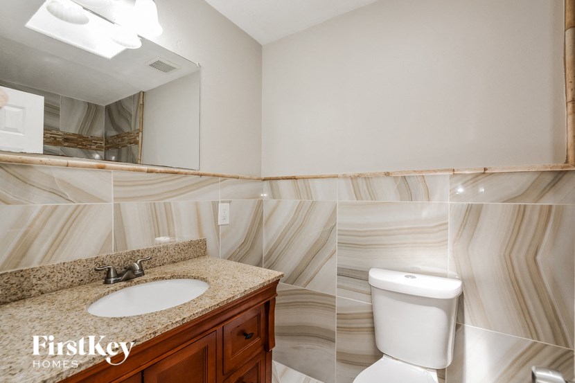 a bathroom with a toilet and a sink