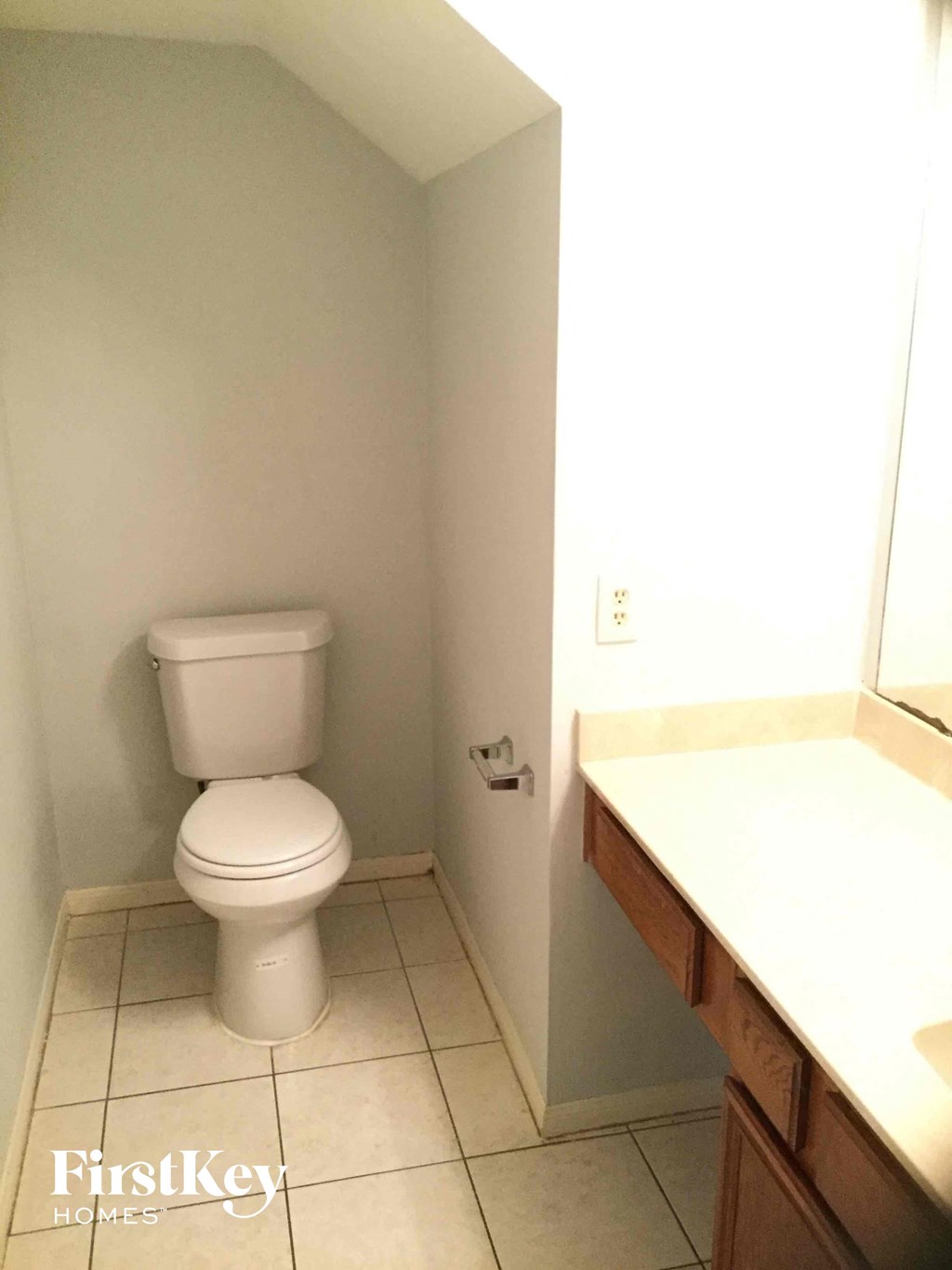 a bathroom with a toilet and a sink