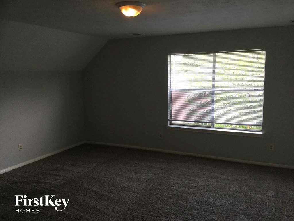 an empty room with a large window