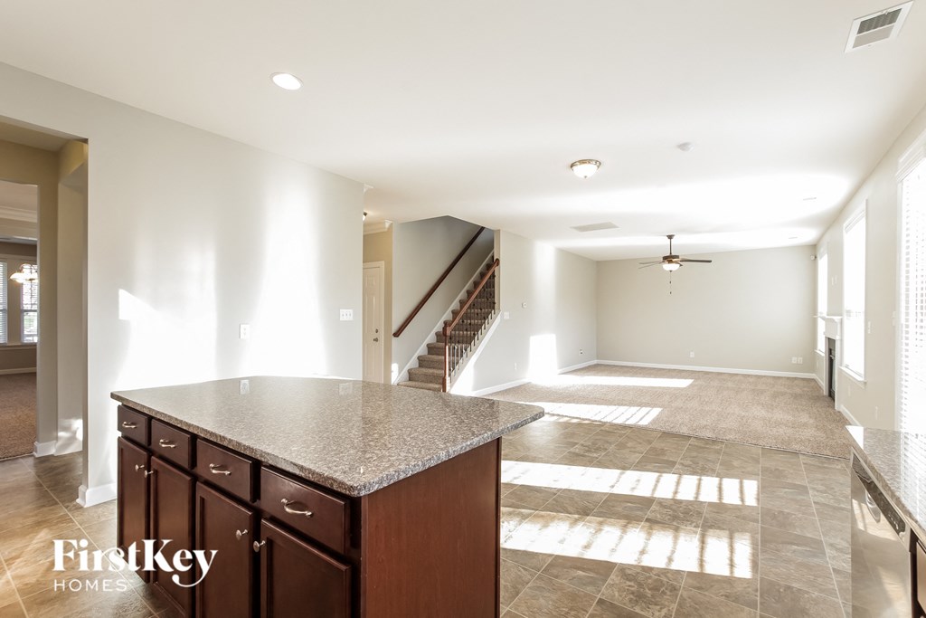 a view of the kitchen and living room from the island