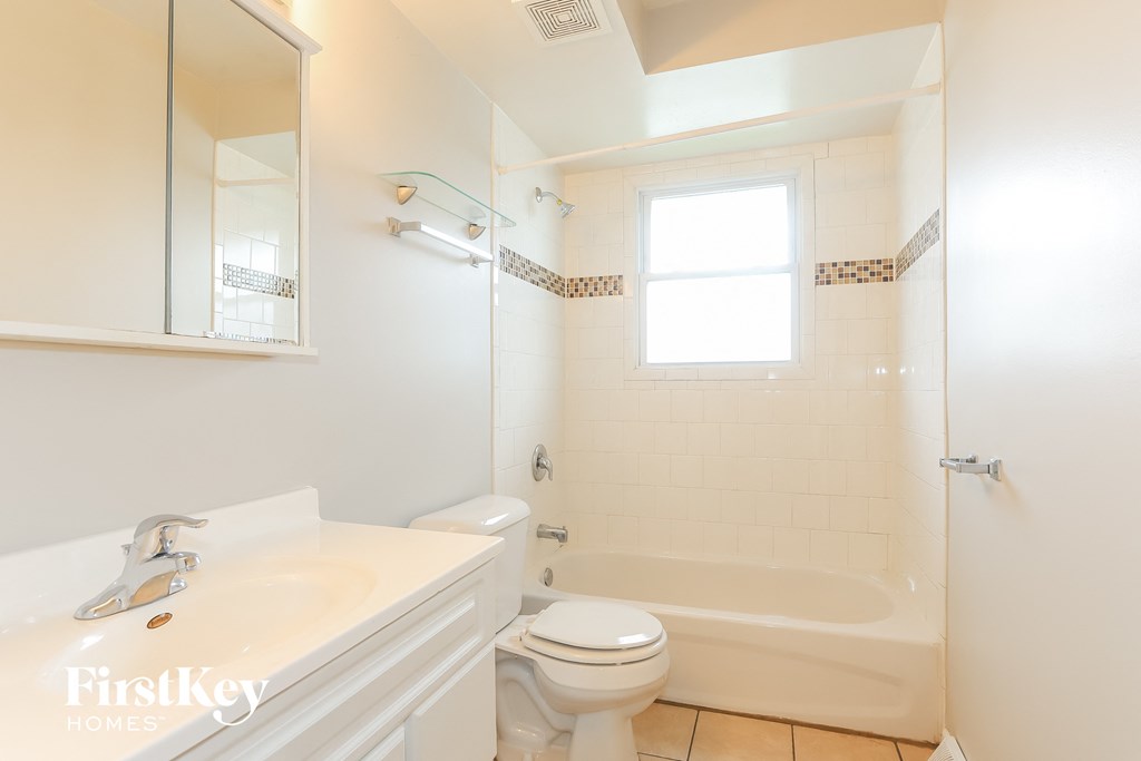 a bathroom with a sink toilet and a shower