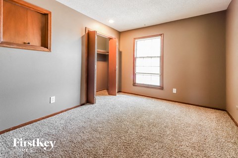 the master bedroom is spacious and has a closet and a window