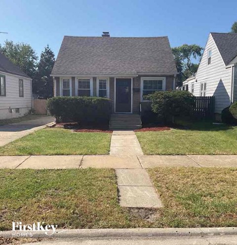 a house with a sidewalk in front of it