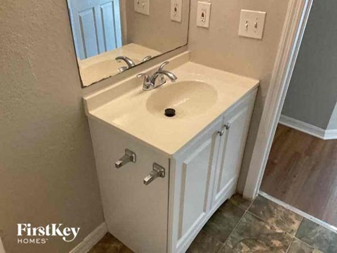 a bathroom with a sink and a mirror