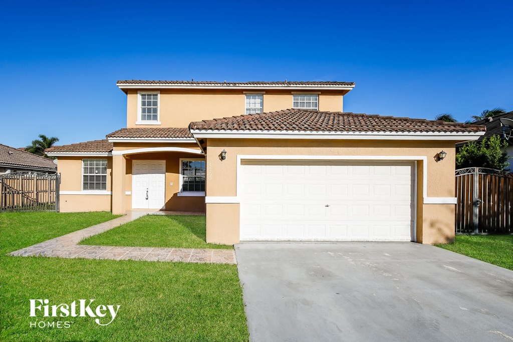 A two-story house with a garage is for sale by FirstKey Homes.