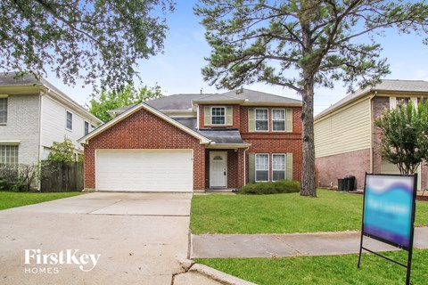 A house with a garage is for sale by FirstKey Homes.
