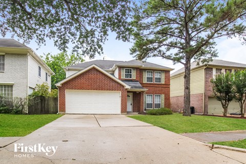 A house with a garage is for sale by FirstKey Homes.