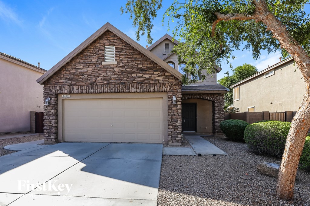 A house with a garage and a driveway.