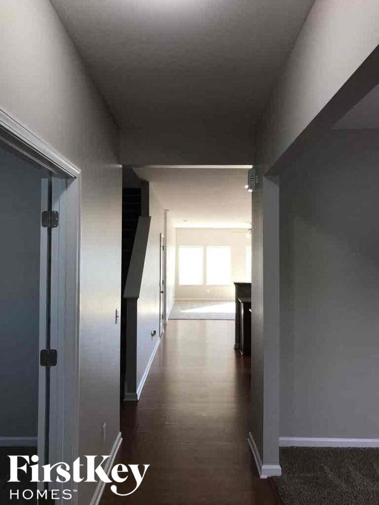 A hallway with a FirstKey Homes logo.
