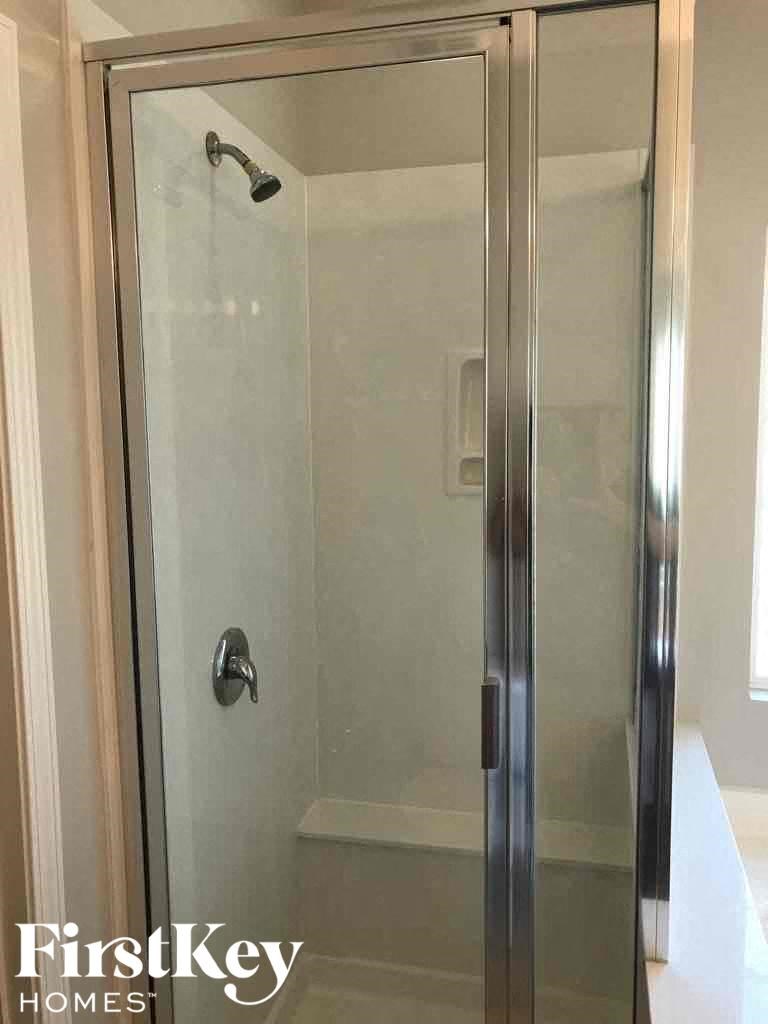 A glass door with a handle and a keyhole.