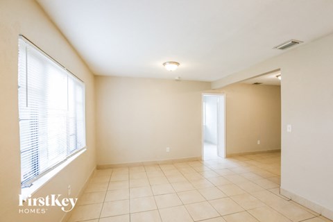 the living room and dining room are spacious and lighted by a large window