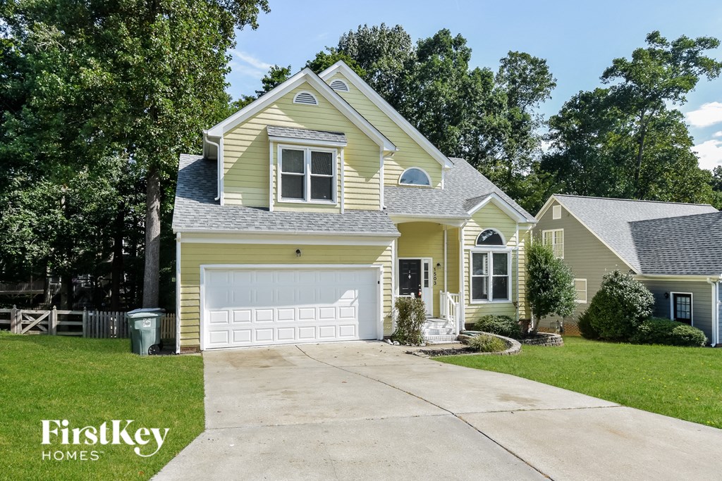 A two-story house with a garage is for sale by FirstKey Homes.