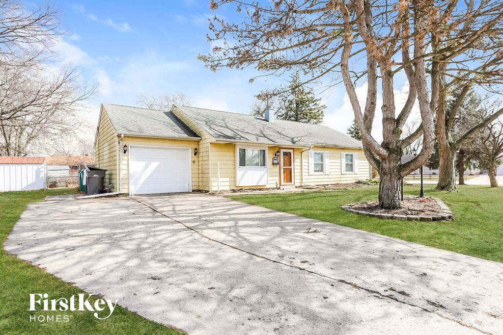 A house with a tree in front of it.