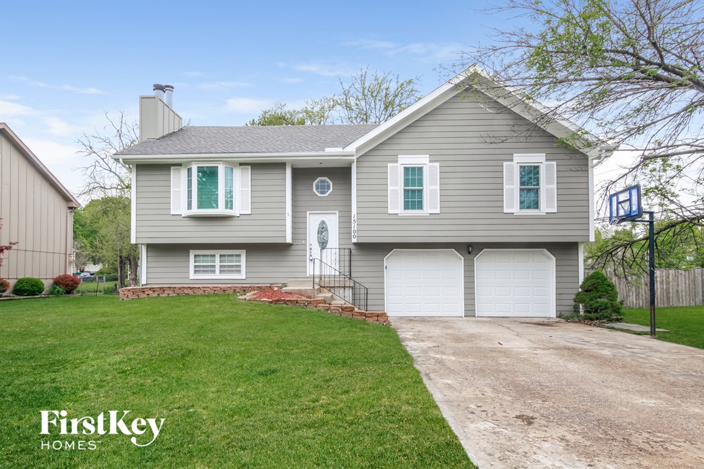 A two-story house with a garage is for sale.