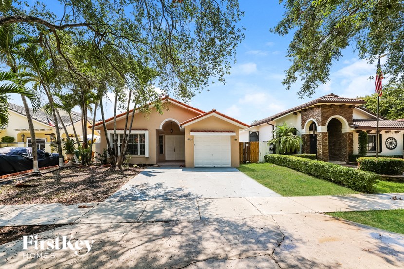 a house with a driveway and a garage door
