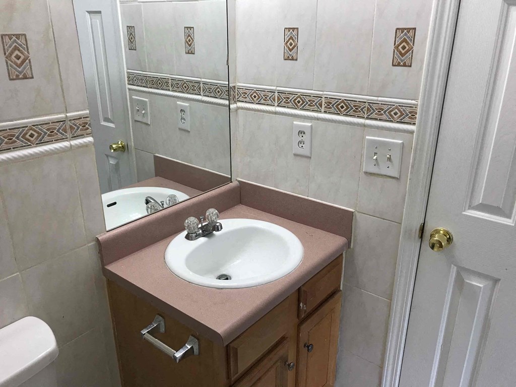 a bathroom with a sink and a mirror