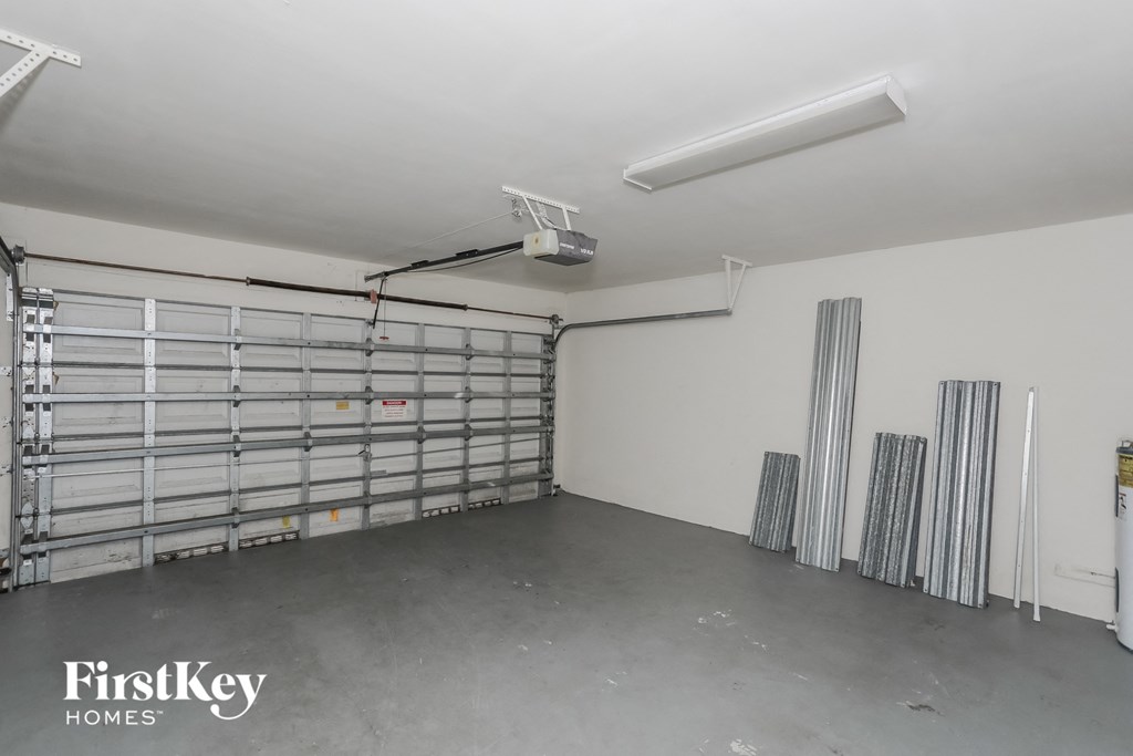the interior of a garage with a steel garage door
