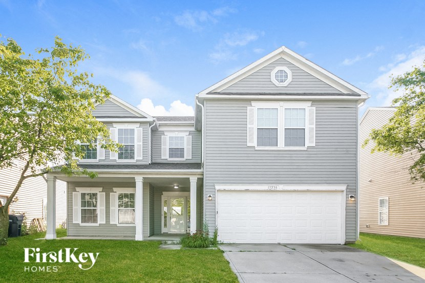 a blue house with a white garage door
