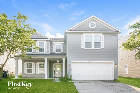 a blue house with a white garage door