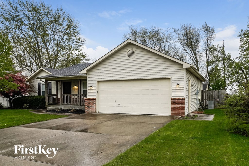a white house with a white garage door