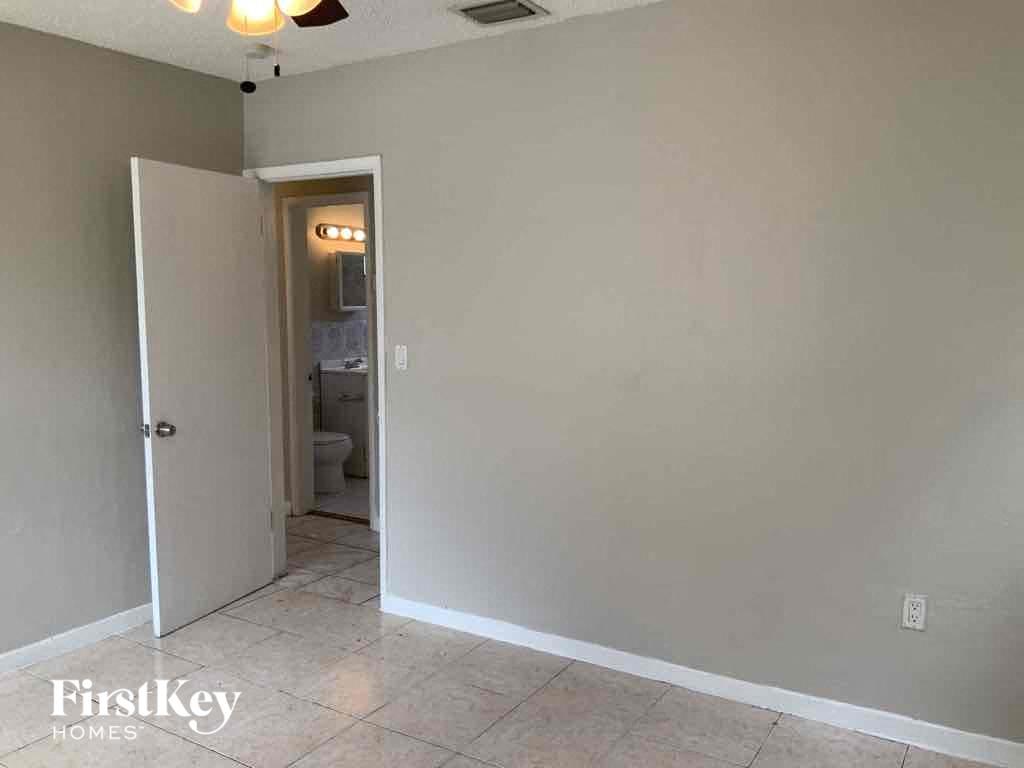 A room with a doorway leading to another room.