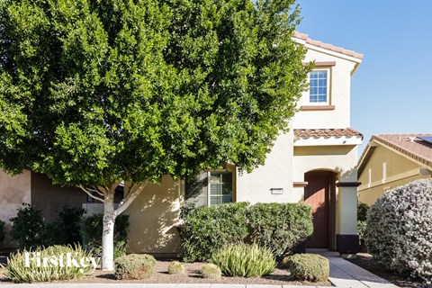 a house with a tree in front of it