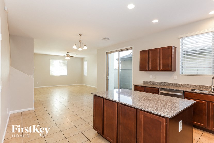 a kitchen and living room with a counter top