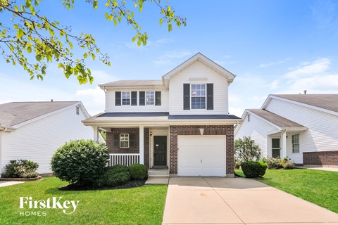 a white house with a white garage door