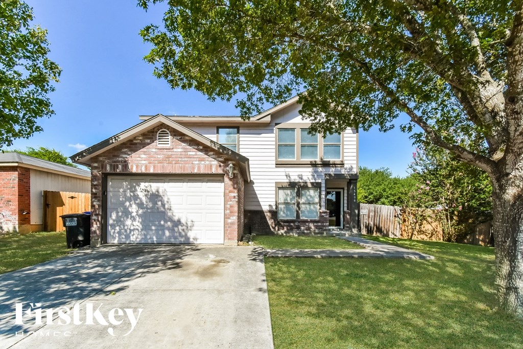 A house with a garage is for sale.