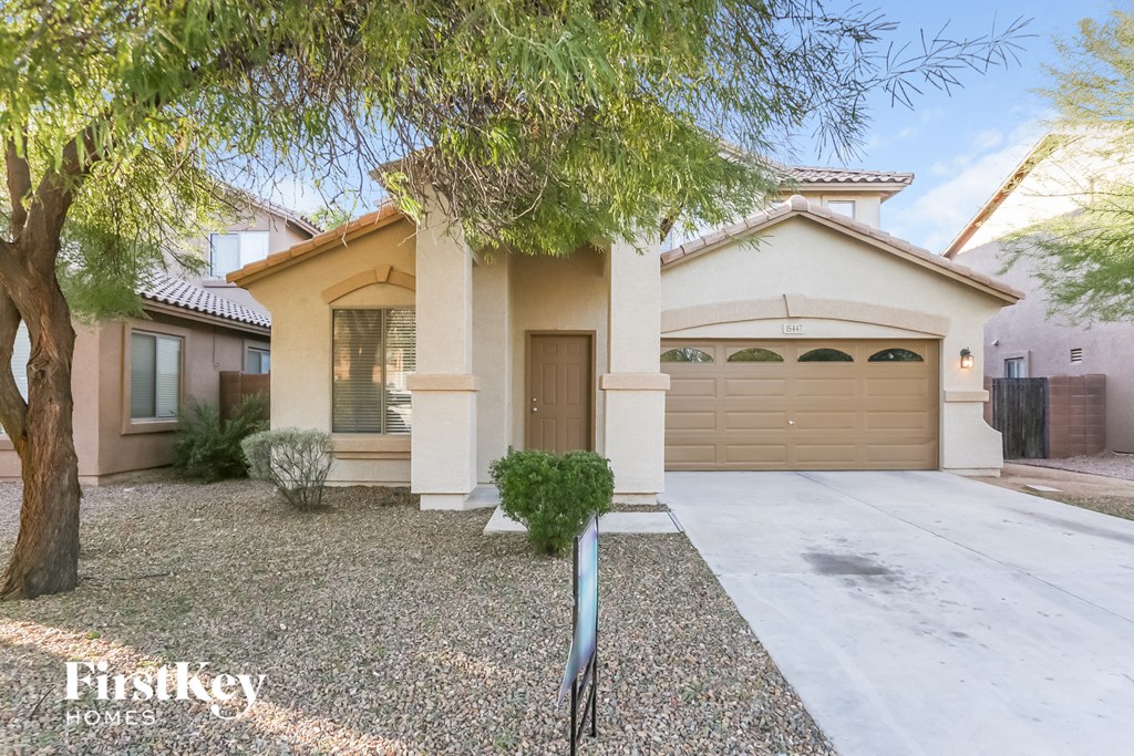 A house with a tree in front of it.