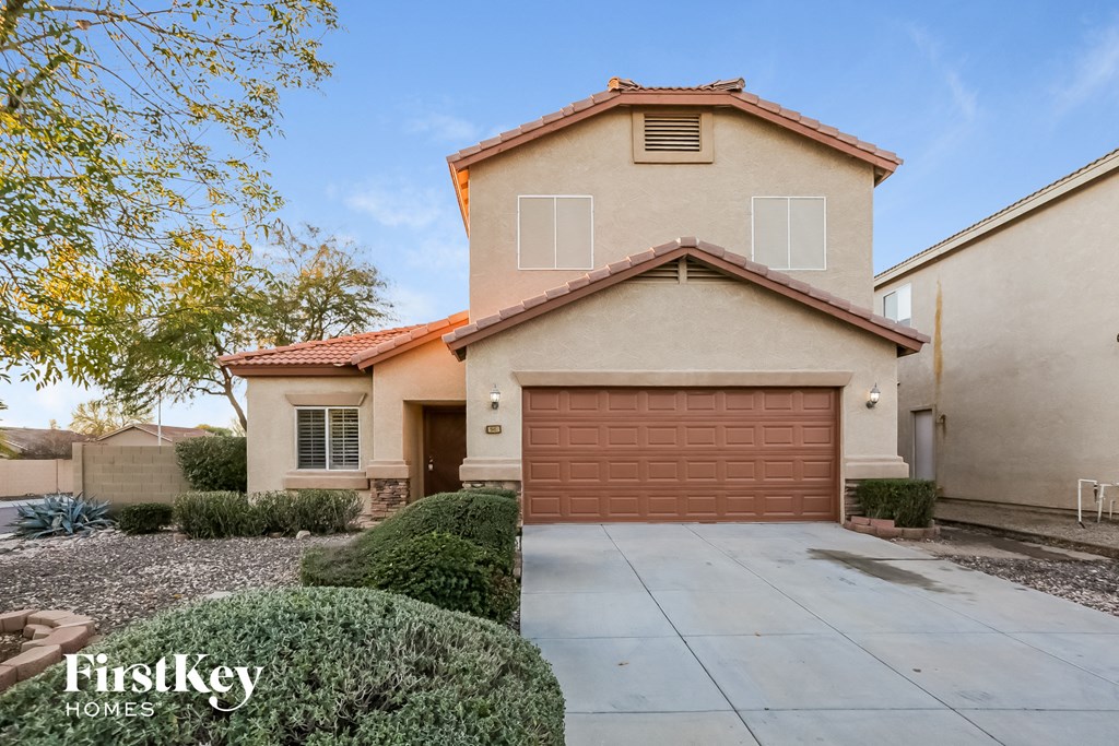 a house with a driveway and a garage door
