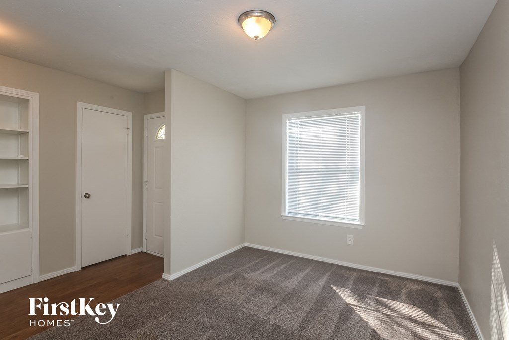 A room with a window and a door is shown.