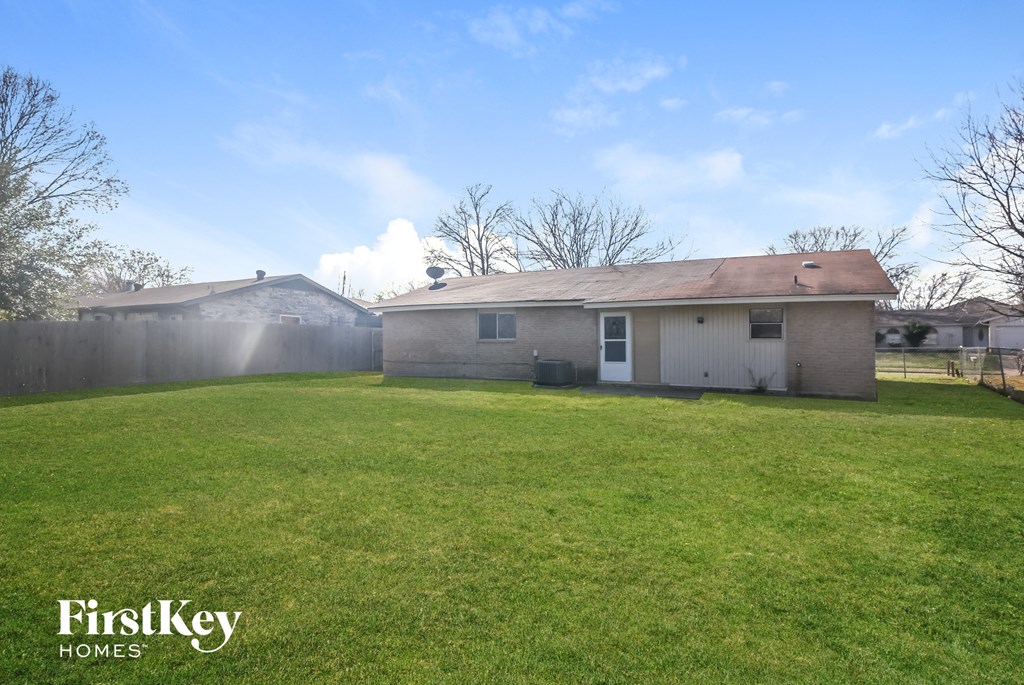 A house with a lawn in front of it is for sale.