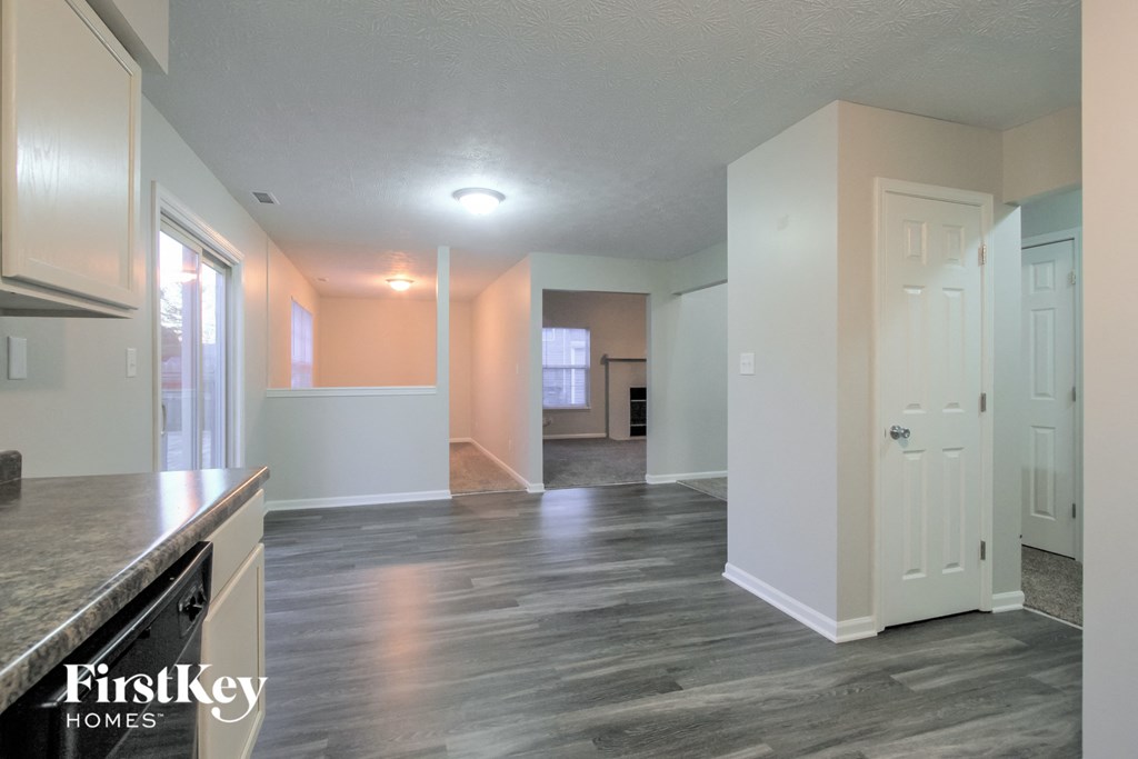the kitchen and living room of an open floor plan