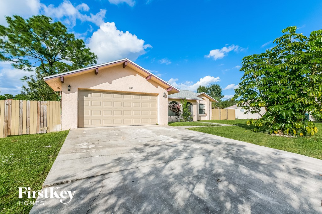 A house with a garage is for sale by FirstKey Homes.
