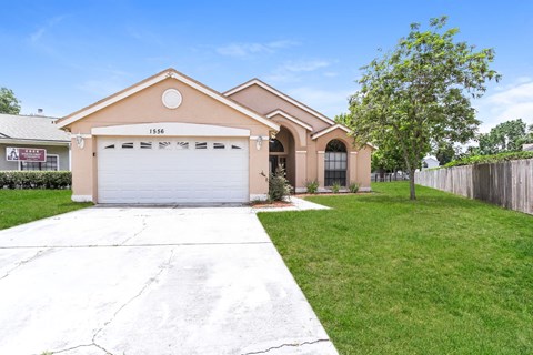 a house with a driveway and a garage door