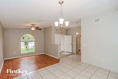 the living room and dining room are spacious and open to the backyard