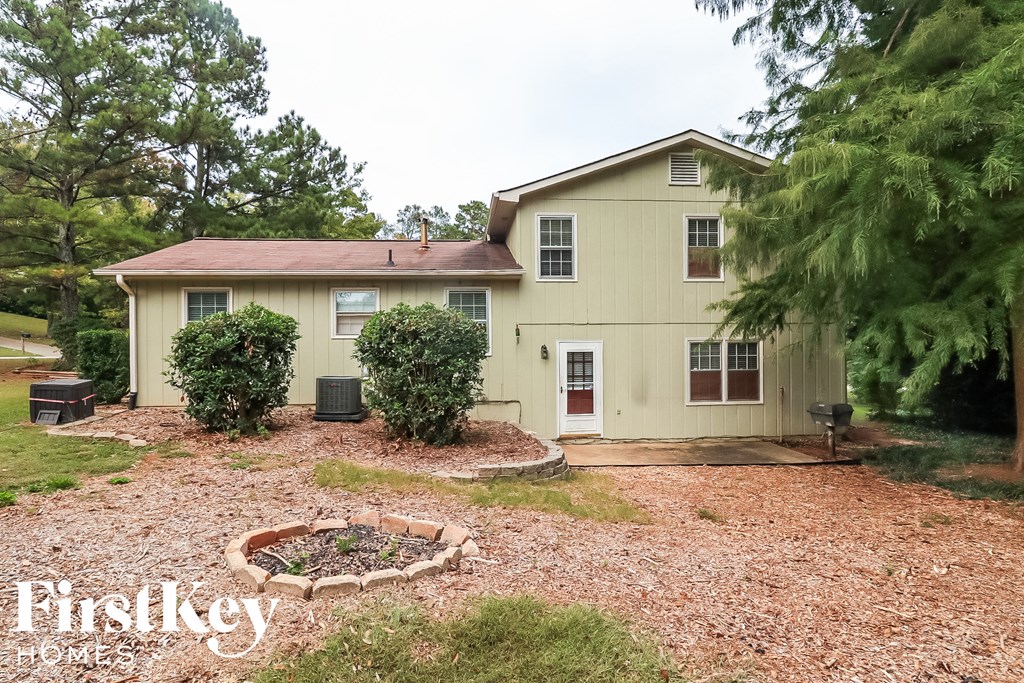 a backyard with a house and a garden