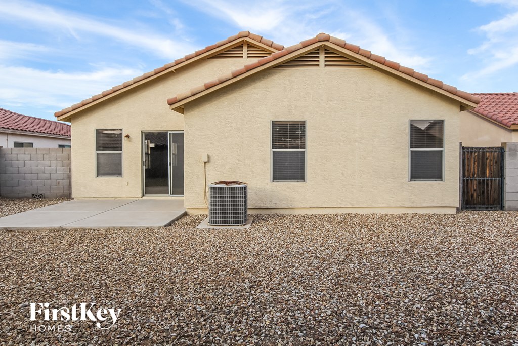 a house with a trash can in front of it