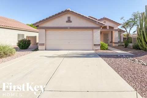 a home with a driveway and a garage door