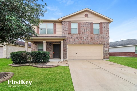 a house with a driveway and a garage door