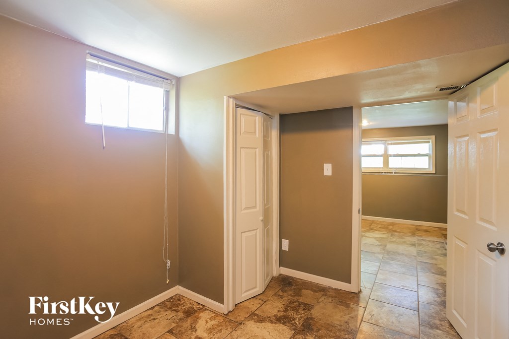 the master bedroom has a walk in closet and a door to the ensuite bathroom