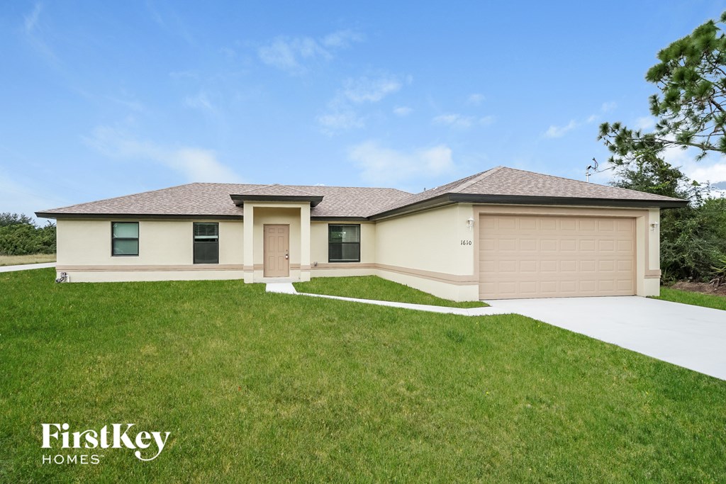 A house with a garage is for sale by FirstKey Homes.