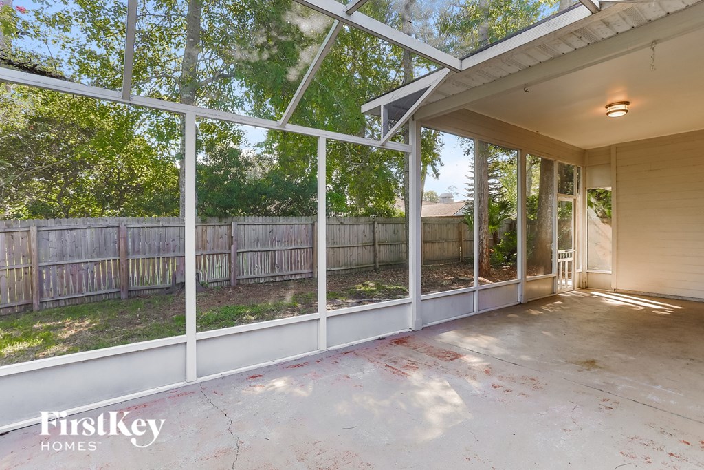 the screened in porch is clean and ready for the family to enjoy