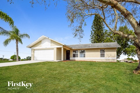 A house with a garage is for sale by FirstKey Homes.